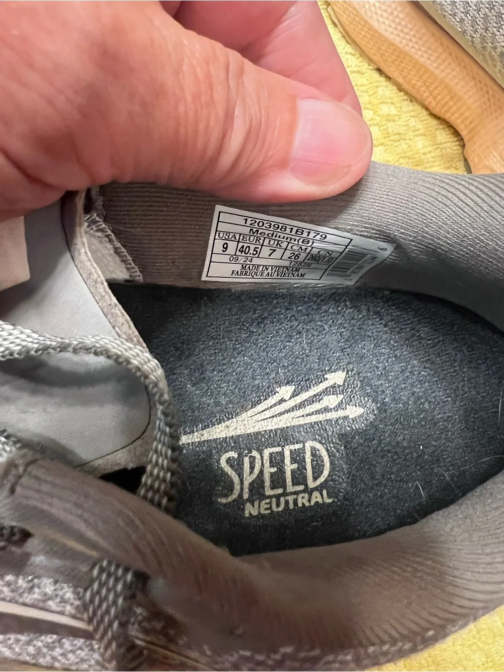 Brooks gray running shoes with pinkish peach midsole